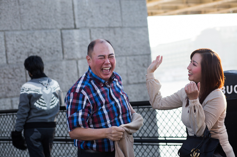 Man laughing by Tower Bridge London