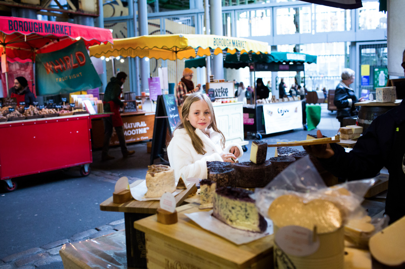 Girl smiling in a market.