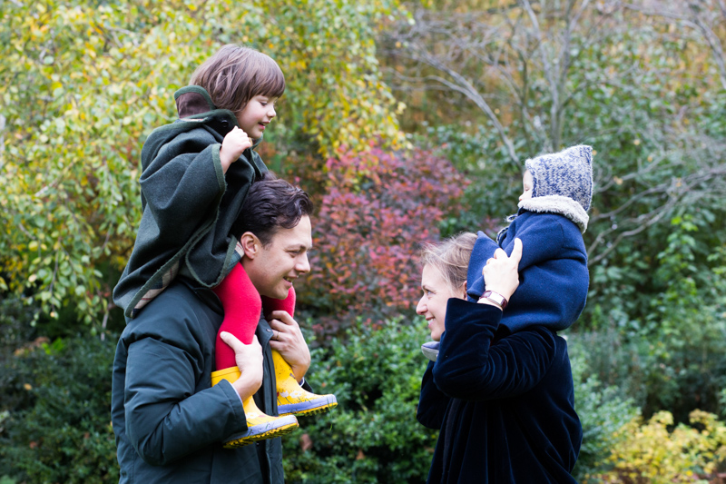 Two children on their parents shoulders