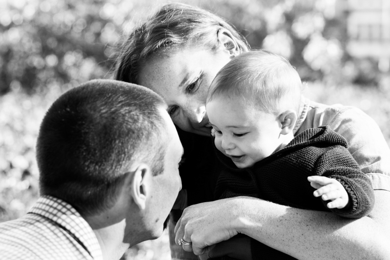 Mum, dad and baby cuddling.