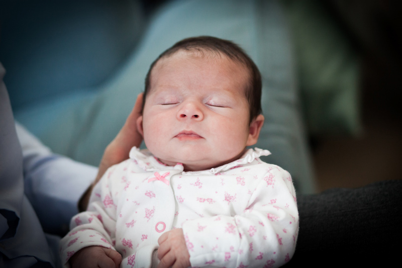 Sleeping baby with green background