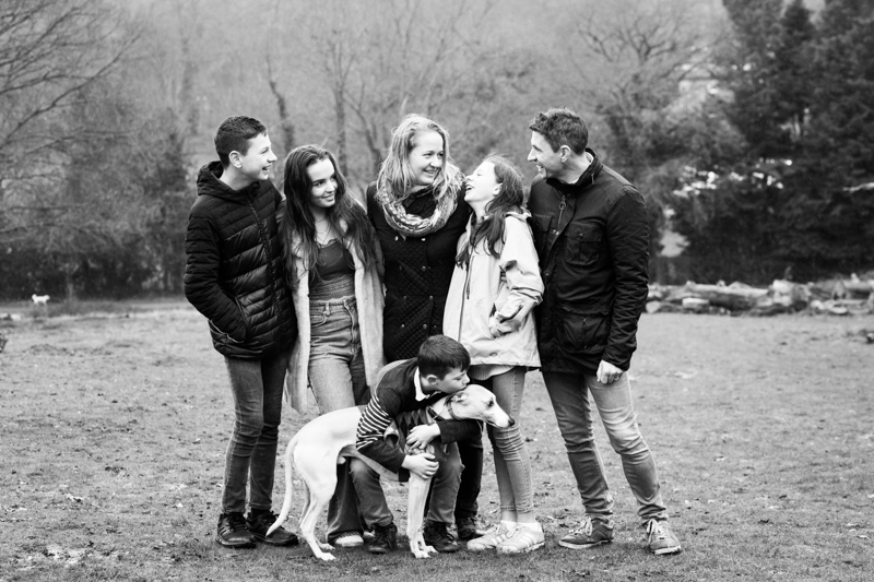 family of six and dog in the park