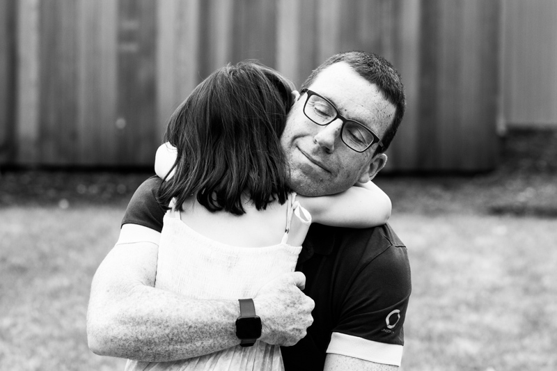 Little girl hugging her Dad. 