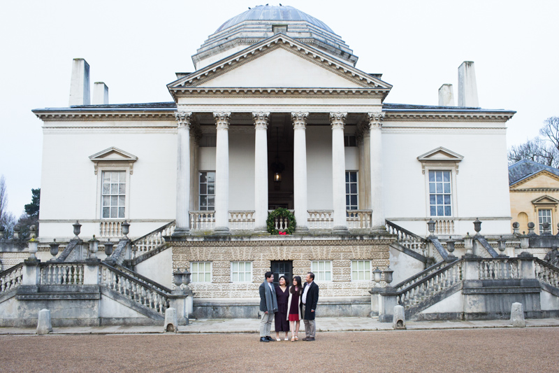 family in front of Chiswick House. 