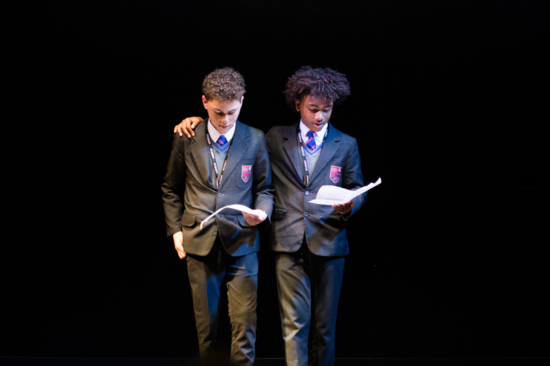Two schoolboys reading. 
