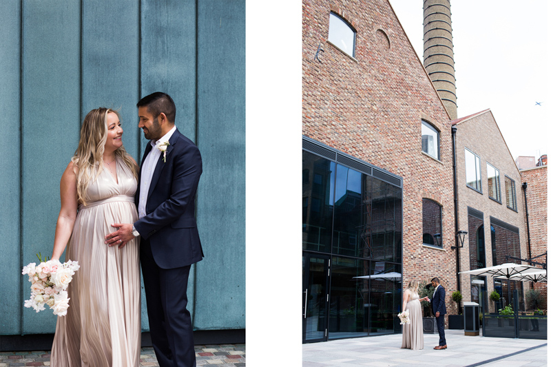 Wedding couple in front of blue wall and beautiful old building. 