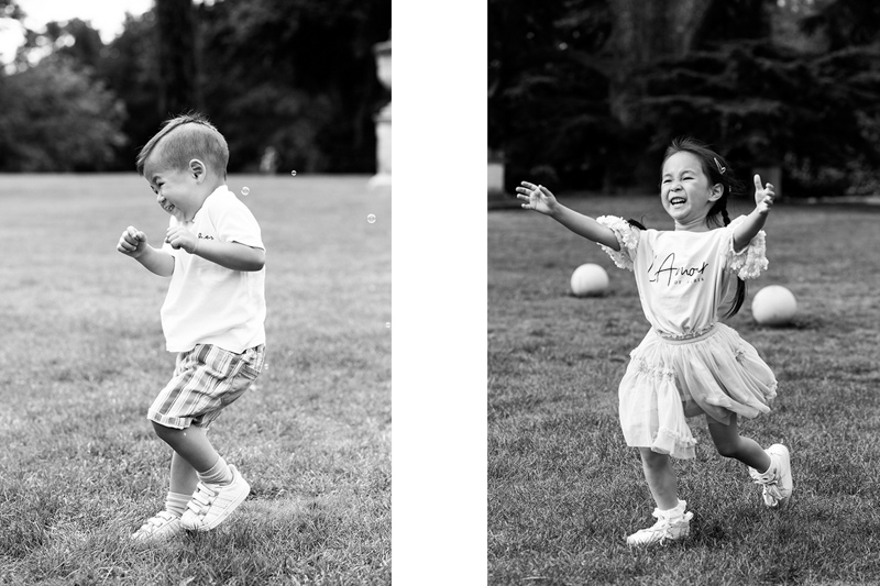 Girl and boy having fun running around on a field. 