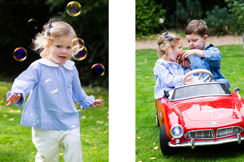 Girl chasing bubbles and two children sharing a pastry in a red toy car. 