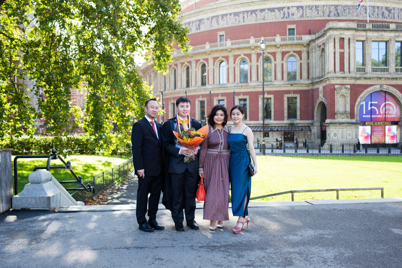 Mum, dad, son and daughter standing in the front of the Albert Hall. 