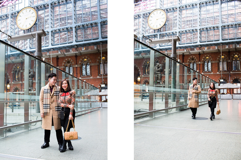 Man and lady walking through St Pancras Station. 