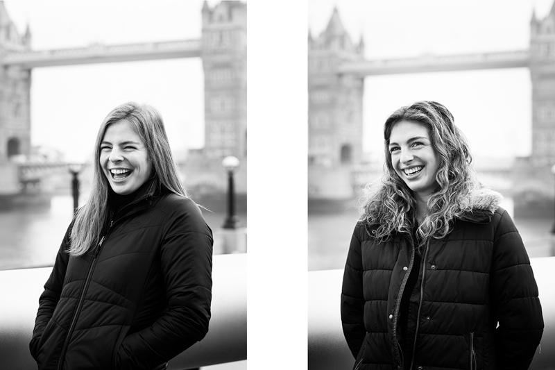 Two young ladies in front of Tower Bridge. 