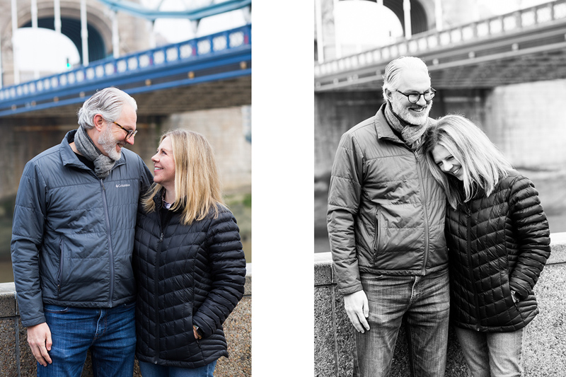 Husband and wife laughing in front of Tower Bridge