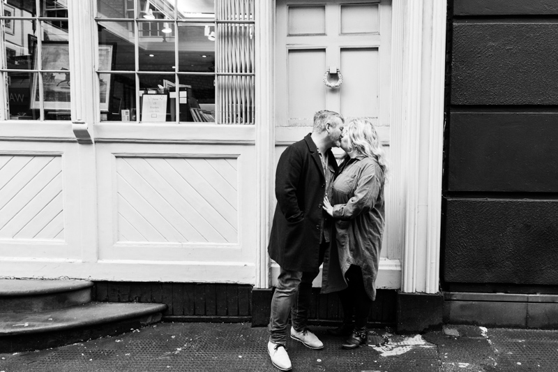 Couple kissing in doorway