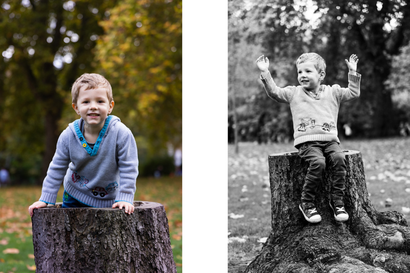 Boy having fun sitting on a tree trunk