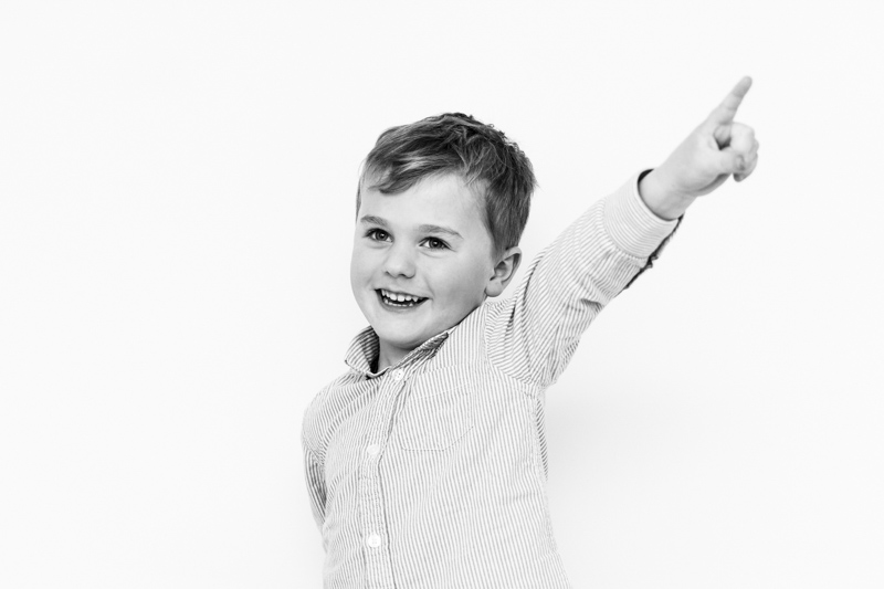 boy with his arm in the air