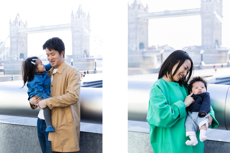Dad holding girl in front of Tower Bridge | Mum holding baby in front of Tower Bridge