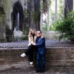 Couple together in old picturesque churchyard