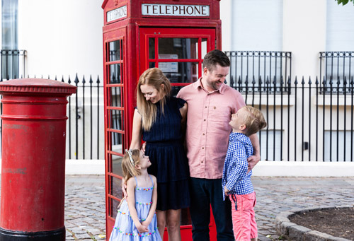 Family in front of phone box
