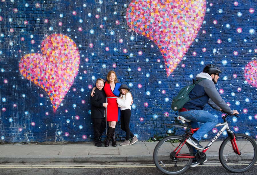Family against a blue wall