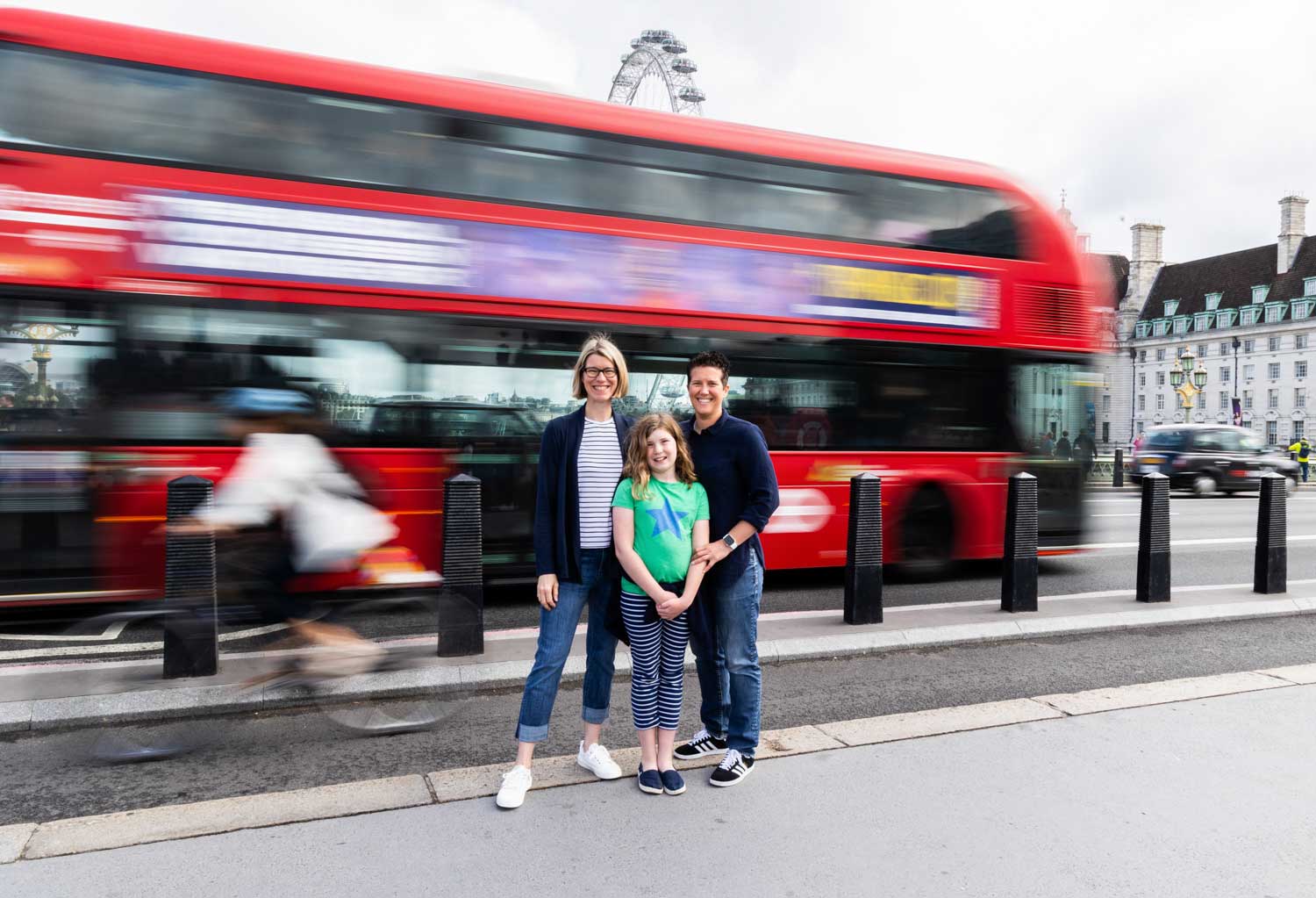 Family photo with a London bus.